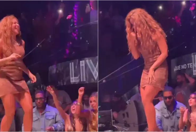 Shakira arriba del escenario, haciendo un gesto de “ojo”