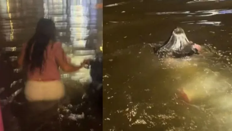 Mujer nada en calles inundadas de Veracruz