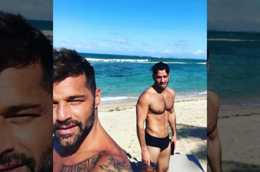 Ricky Martin y su pareja en la playa.jpg