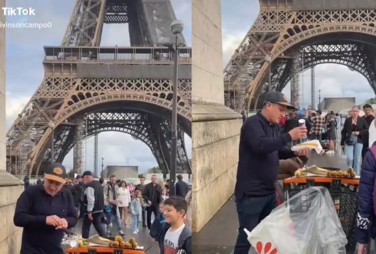 Hombre vende elotes en Torre Eiffel