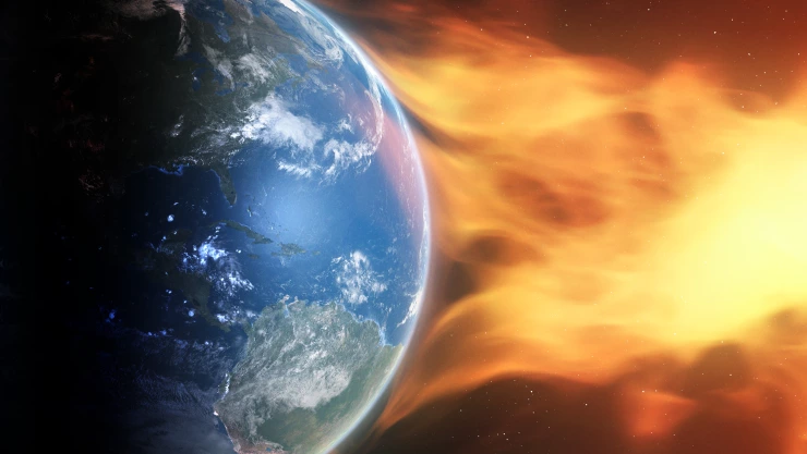 Ilustración de una eyección de masa coronal que impacta en la atmósfera terrestre.