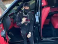 Peso Pluma en su auto.jpg