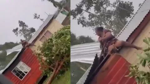 Mujer se enfrenta a Huracán Beryl