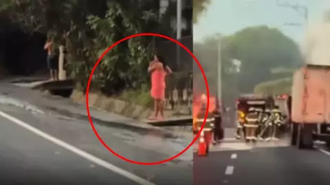 Mujer sale en toalla al chisme