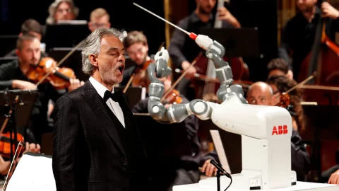 Humanoid robot YuMi conducts the Lucca Philharmonic Orchestra performing a concert alongside Italian tenor Andrea Bocelli at the Verdi Theatre in Pisa