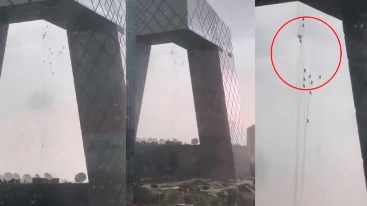 Trabajadores quedan colgados en alto edificio de Beijing, China