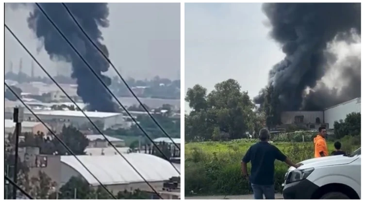 Fuerte incendio consume bodega de fábrica en Tultitlán, Edomex. En la image se observan las enormes columnas de humo generadas por las violentas llamas que consumen todo a su paso.