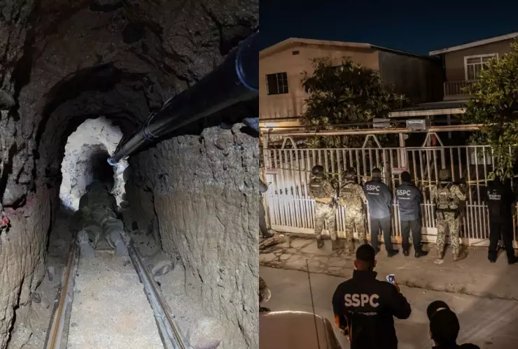 Una vista profunda de un túnel subterráneo estrecho y oscuro con paredes de tierra rugosas. En el centro del túnel, hay un conjunto de vías simples sobre una base de arena o tierra, con una figura tumbada en una especie de carrito o plataforma en las vías, mirando hacia el fondo del túnel. Un tubo oscuro y grueso corre a lo largo del techo del túnel en el lado derecho.