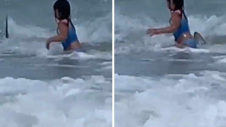 Momento en que niña escapa de tiburón en Hawái; video.jpg