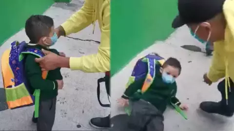 Niño se cae por el peso de su mochila.jpg
