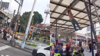 hombre colgado en estructura metálica en Metro Mixcoac