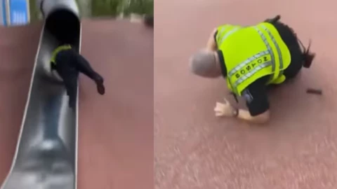Policía cae de tobogan.
