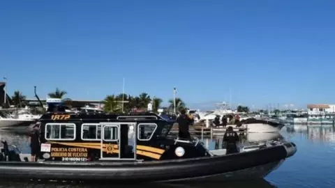 Hallan cadáver flotando en Puerto de Yucalpetén; investigan homicidio