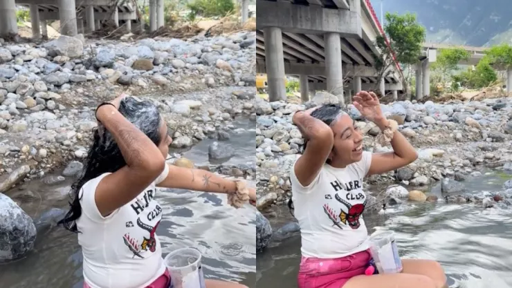 Joven aprovecha la lluvia y se baña en el río porque no tiene agua en su casa