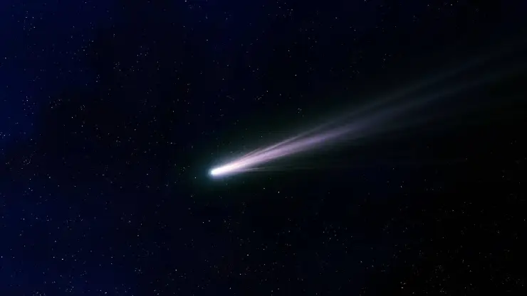 la cola de un cometa que irradia luz