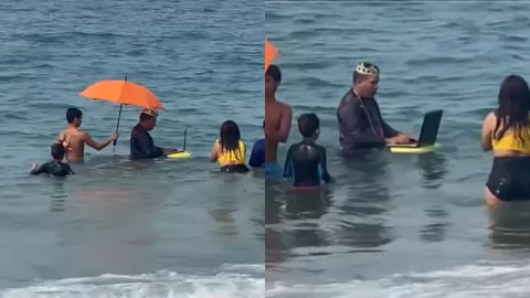 VIDEO: ¿Home Office? Captan a hombre trabajando en el mar mientras está de vacaciones