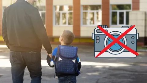 Alumno con su padre entrando a la escuela