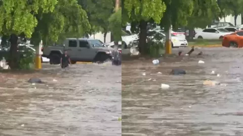 Hombre se baña en inundación en Culiacán