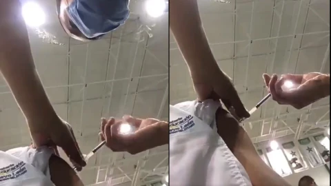 enfermera derrama vacuna.jpg