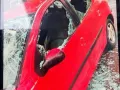 Auto con cristales rotos tras granizada en Chihuahua