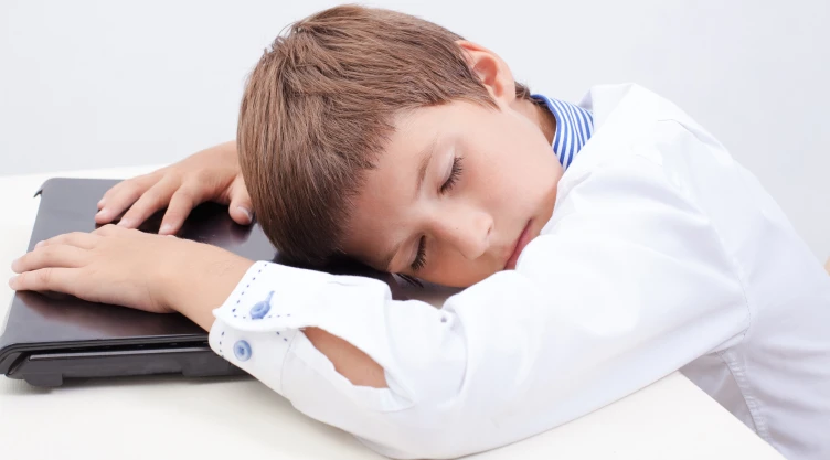 Boy using his laptop computer