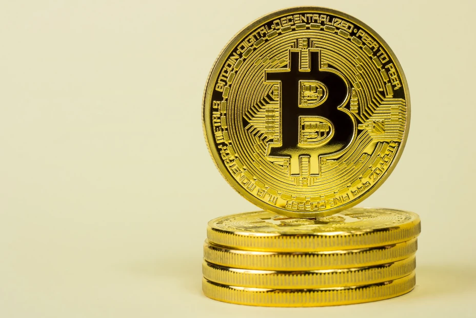 Photo Of Golden Bitcoin virtual currency coin.