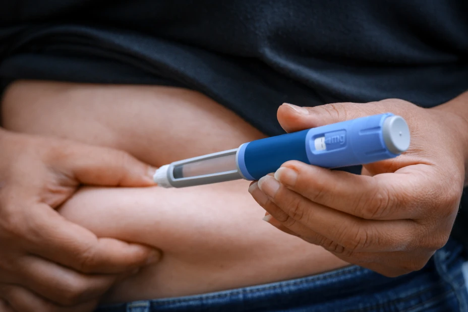 Adult injecting insulin pen for diabetes management