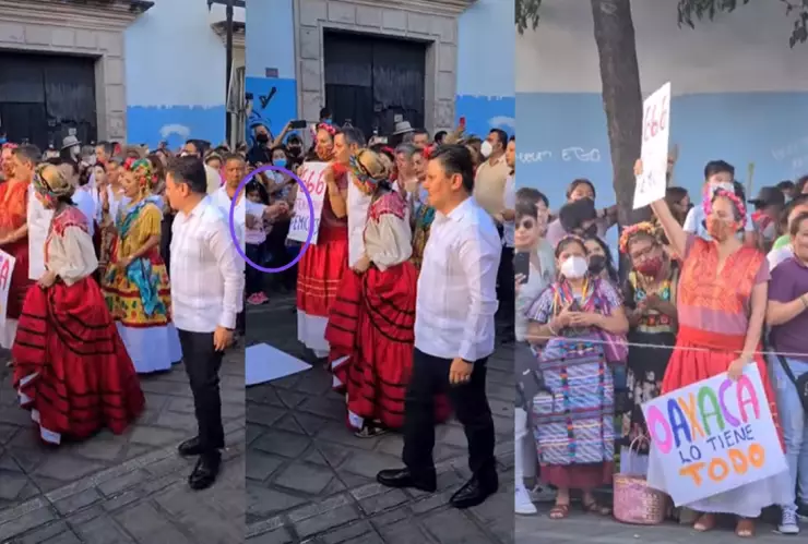 Mujer se manifiesta en la Guelaguetza.