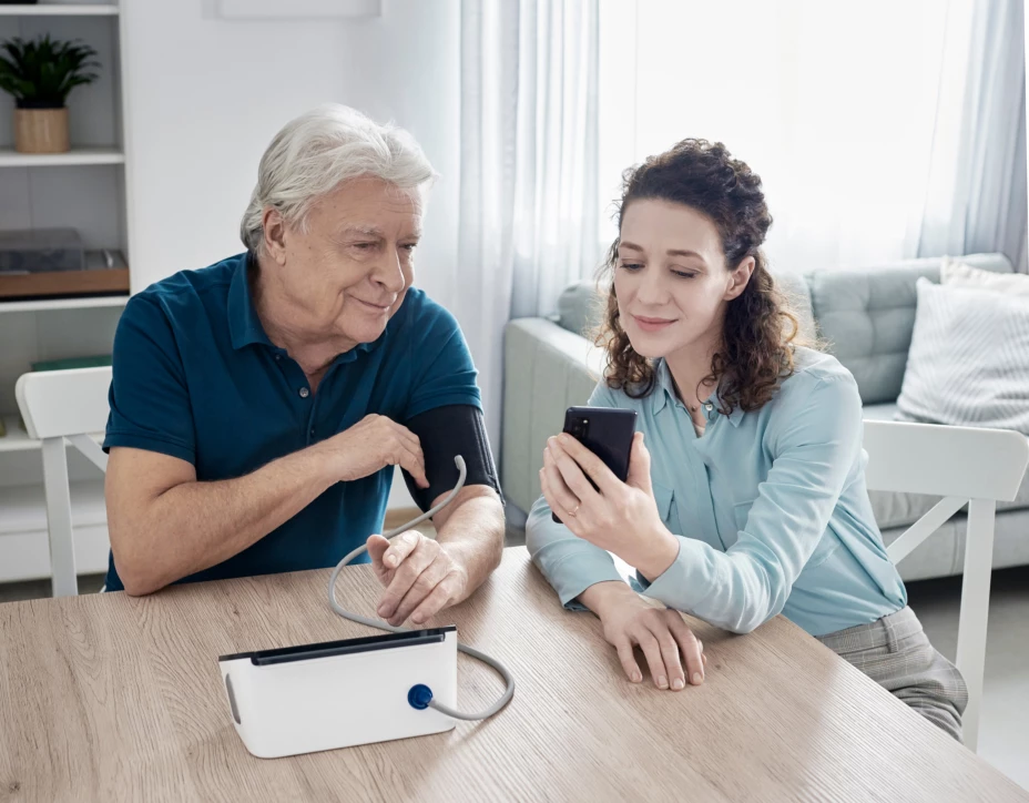 Complete_HEM-7530T_Product-in-use_Older User_with Caregiver_Results_Close.jpg