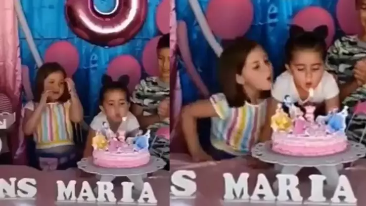 nina sopla pastel.jpg