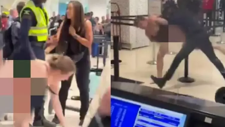 VIDEO_ Mujer se quita la ropa en aeropuerto e intenta desarmar a un policía.jpg