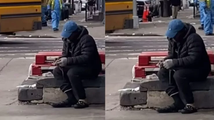 Hombre en situación de calle come rata