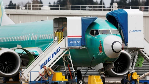 FILE PHOTO: An employee works near a Boeing 737 Max aircraft at Boeing’s 737 Max production facility in Renton, Washington