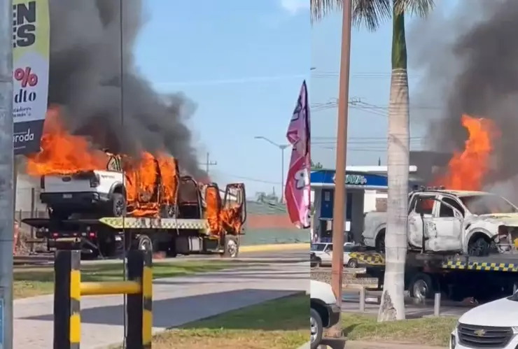 Queman camioneta y grúa en el bulevar Las Orquídeas frente a Plaza Carolinas, en Culiacán. .jpg
