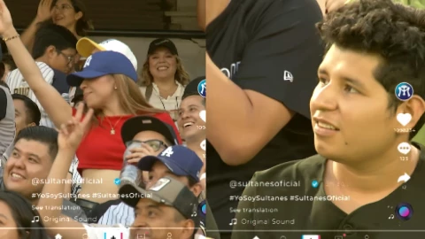 Cachan a hombre viendo bailar mujeres en partido de béisbol