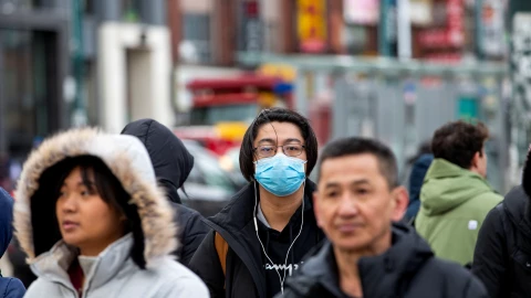 Pedestrians walk in the Chinatown district of downtown Toronto