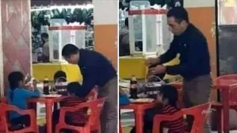 captan a hombre dejando su desayuno y dándole de comer a tres niños sin calle .jpg