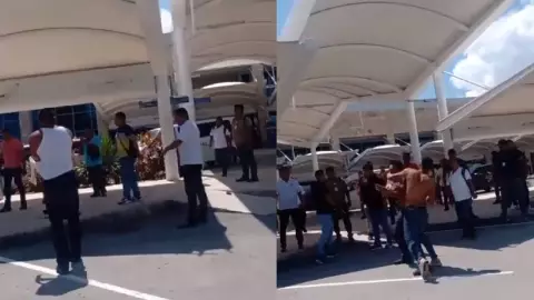 ¡Hasta sin playera! Captan pelea de taxistas en aeropuerto de Cancún