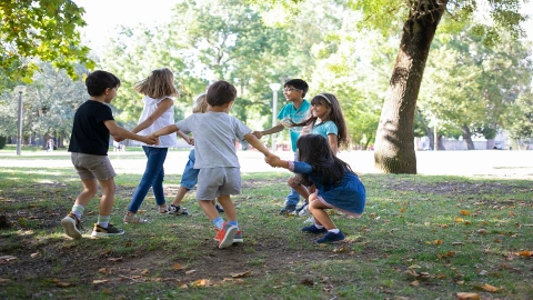 Happy children playing together outdoors