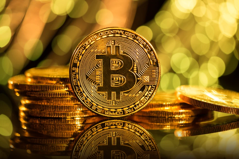 Bitcoin gold coins with defocused abstract background. Virtual cryptocurrency concept.