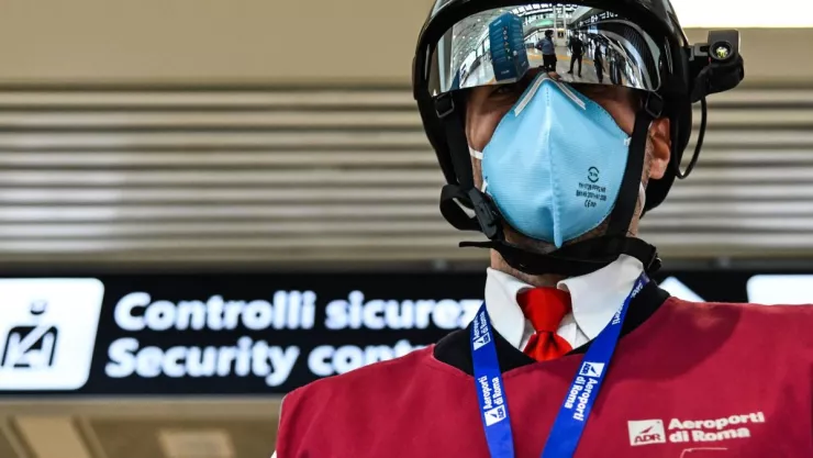 https___cdn.cnn.com_cnnnext_dam_assets_200506174945-a-fiumicino-airport-employee-displays-a-smart-helmet-portable-thermoscanner-to-screen-passengers-and-staff-for-covid-19-on-may-5-2020-at-romes-fiumicino-airpo.jpg