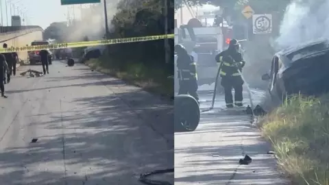 ¡Vaya accidente! Tesla se cae de puente en Puerto Aventuras y se incendia en la vía (1).jpg