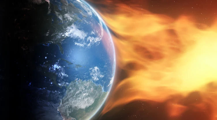 Ilustración de una eyección de masa coronal que impacta en la atmósfera terrestre.