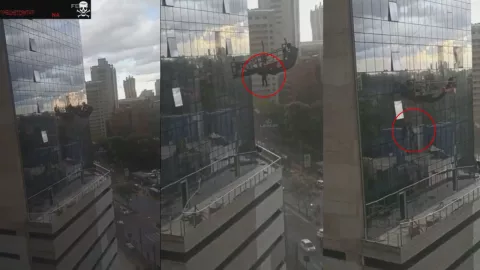 Hombre casi cae de un edificio