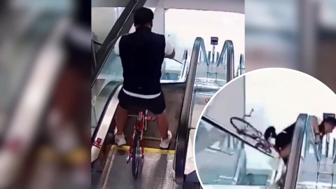 Se fue con todo y bici al tratar de bajar.png