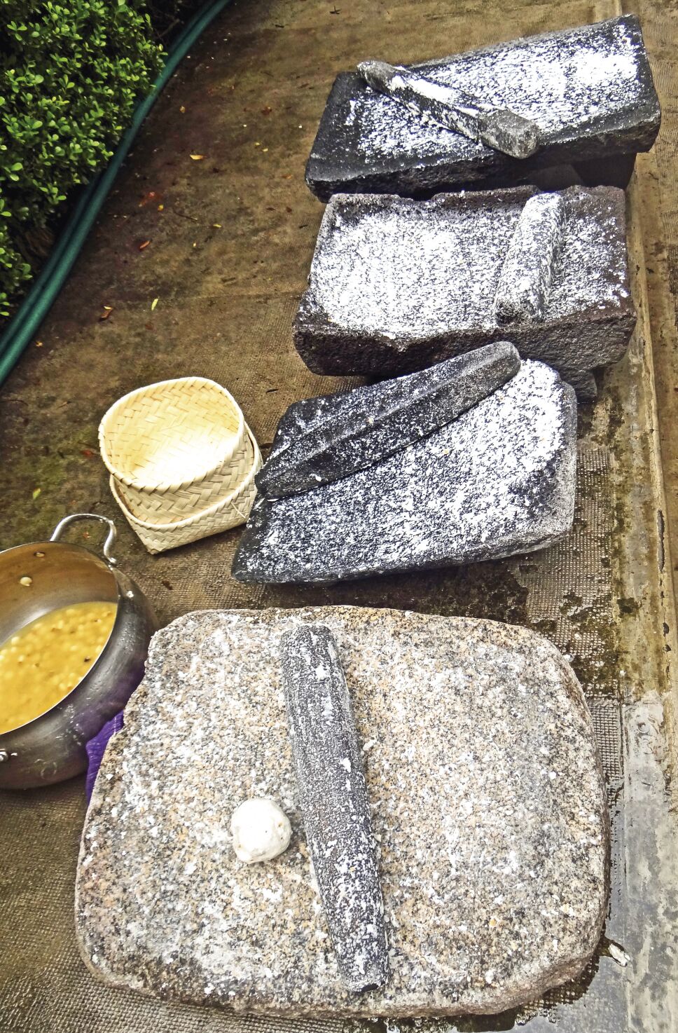 Metate, metlatl or mealing stone for corn in Mexico