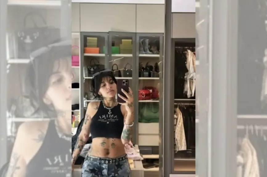 Cazzu entre bolsas.jpg