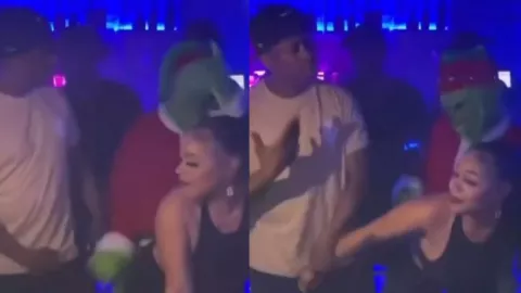 Grinch perrea con joven