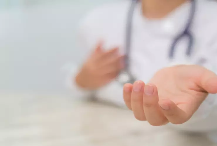 Doctor holding something in his hand