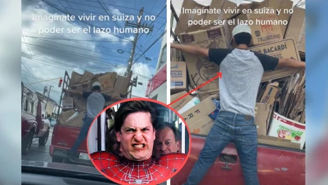 Hombre detiene cajas con su cuerpo